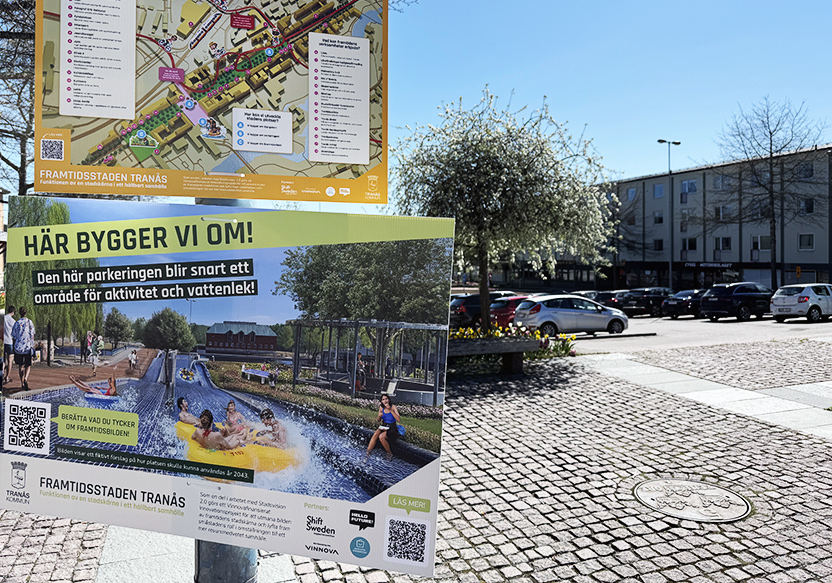 Skyltar med färgglada motiv, i bakgrunden en parkering.