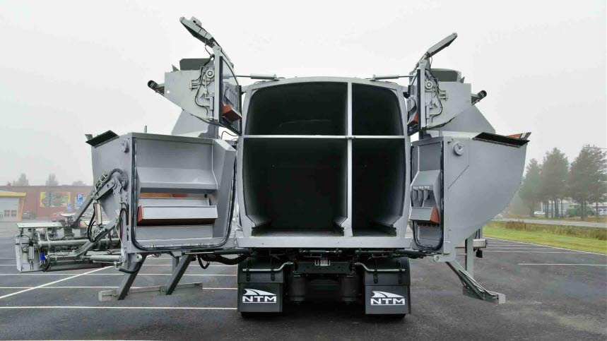 Bild på sopbil med fyra fack. 